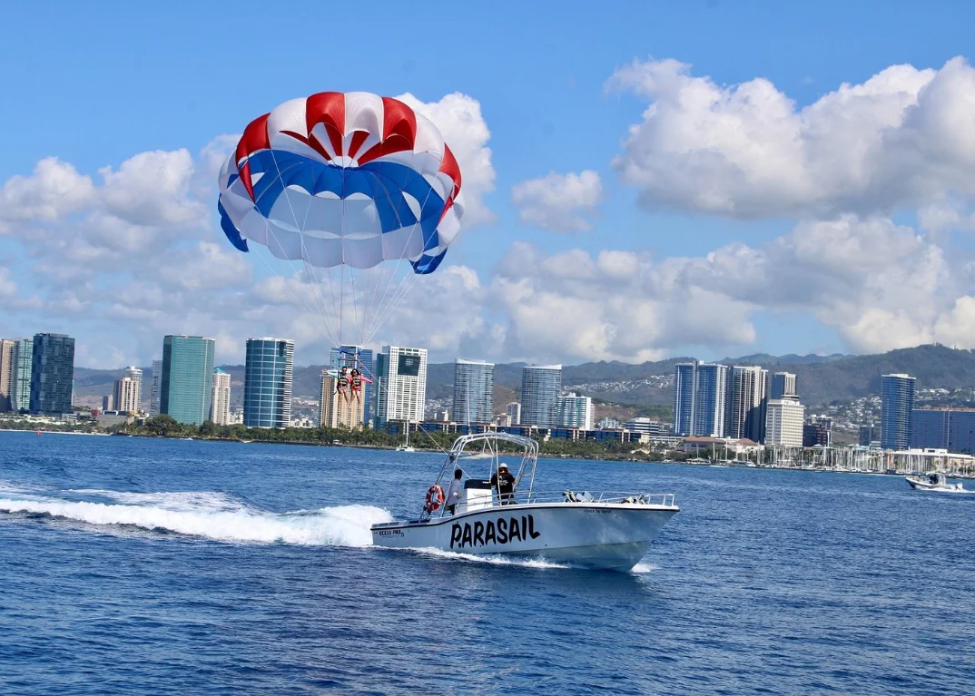 Parasail in flight above the ocean off Waikiki